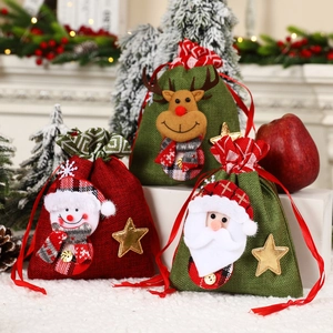 Three Christmas drawstring gift bags featuring 3D Santa, Snowman and Reindeer designs