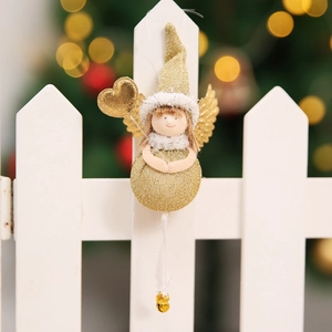 Detail of Christmas angel hanging ornament with gold glitter dress and small metal bells