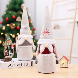 Detail of Christmas gnomes with snowflake embroidery in a cozy festive setting