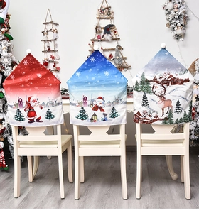 Detailed view of three festive Christmas chair covers featuring Santa, snowman, and reindeer