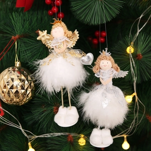Detail of white Christmas angel ornaments with feather skirts and sparkling wands