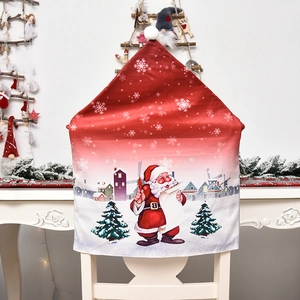 Christmas chair cover featuring Santa Claus and winter scene on bright red fabric