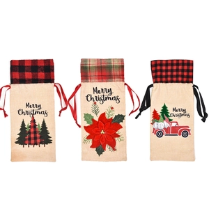 Three-piece Christmas burlap wine bottle bags with gnome truck and floral designs