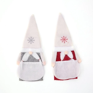 Detail view of red and gray Christmas gnome wine bottle covers with snowflake embroidery