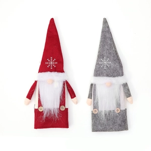 Christmas gnome wine bottle covers with snowflake patterns and long white beards in red and grey