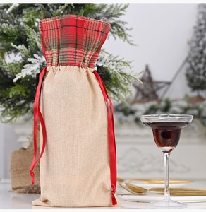 Detail of Christmas wine bottle cover with red plaid trim and satin drawstring tie