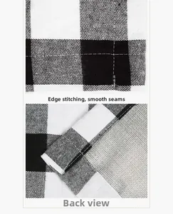 Detail view of high-quality flat stitching and edge hemming on the black and white plaid runner