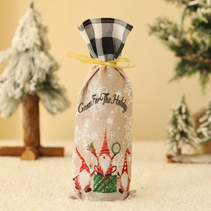 Christmas gnome wine bottle bag with checkered trim and festive snowflake patterns