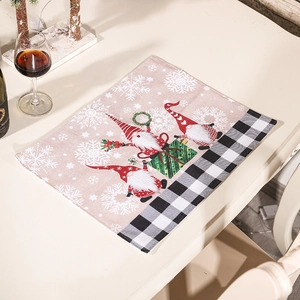 Christmas table mat with festive gnomes and black white plaid border on wood table