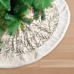 Plush 122cm Christmas tree skirt with golden flower branch pattern on white wood floor