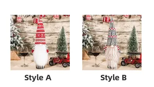 Detail view of two Christmas gnome wine bottle covers with knitted hats and long beards