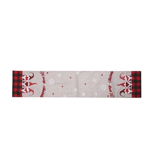 Christmas gnome table runner with Merry Christmas text and red plaid borders on grey fabric