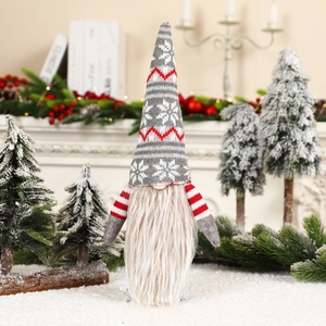 Detail of Christmas gnome wine bottle topper with grey knitted snowflake hat and long beard