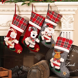 Detailed view of four festive Christmas stockings hanging on a white mantle with 3D characters