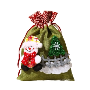 Green burlap Christmas snowman drawstring gift bag with 3D tree and fence decoration