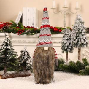 Knitted Christmas gnome wine bottle cover with long brown beard and festive red pointed hat