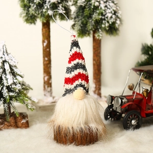 Lighted Christmas gnome ornament with red striped hat and white beard in snow scene