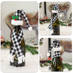 Close-up of black and white plaid Christmas wine bottle hat and scarf set for table decor