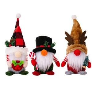 Three-piece Christmas gnome set with plaid hats, reindeer antlers, and festive decorations