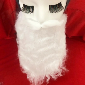 Detailed view of white faux fur Santa beard set with curly mustache on a festive background