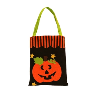 Halloween pompoen draagtas van vliesstof met een glimlachend gezicht voor traktaties