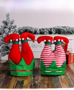 Detailed view of Christmas elf leg hats with gold bells and festive serrated edges