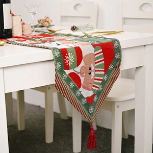 Weihnachtstischläufer mit Weihnachtsmann, roten und grünen Farben und Quasten
