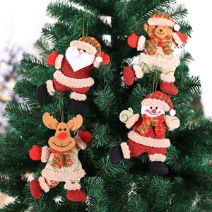 4-piece set of Christmas fabric dolls including Santa and Reindeer hanging on green tree