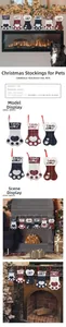 Detail of plaid pet Christmas stockings with I Woof You embroidery and bone shape