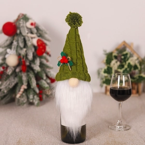 Christmas gnome wine bottle cover in green knit with beard and holly for festive decor