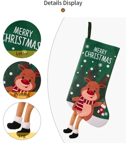 Detail of green Christmas stocking with cartoon reindeer and decorative hanging legs
