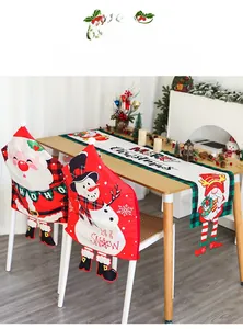 Christmas dining set with Santa and snowman chair covers and red checkered table runner