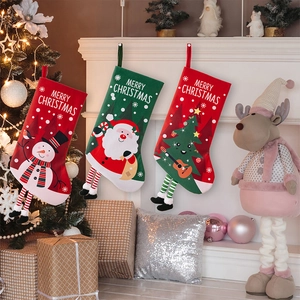 Detailed view of red and green Christmas stockings with character designs and hanging legs