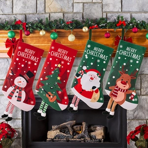 Set of 4 festive Christmas stockings with cartoon characters hanging on a decorated fireplace