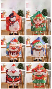Detail of Christmas chair covers featuring festive Santa, snowman and elf designs with boots