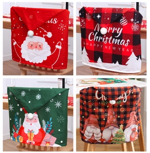 Detail of four festive Christmas chair covers with Santa and gnome patterns