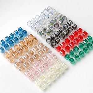 Macro view of colorful faceted square crystal beads with center holes for DIY jewelry making