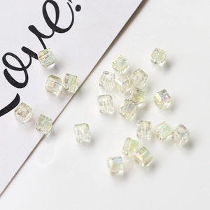Detailed close-up of square AB crystal beads with multifaceted aurora finish for DIY jewelry