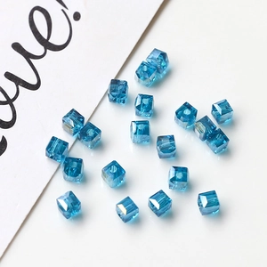 Close-up of faceted lake blue crystal cube beads for DIY jewelry making and earrings