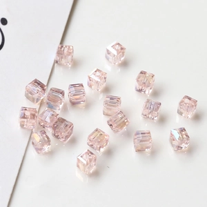 Macro shot of shimmering champagne AB crystal cube beads for DIY jewelry making