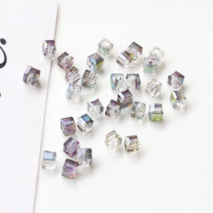 Macro shot of iridescent faceted cube crystal beads for DIY jewelry making and craft design