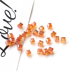 Macro shot of faceted amber crystal cube beads for DIY jewelry and earring making