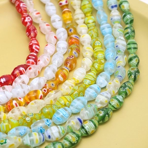 Handmade colorful millefiori glass beads in oval shape for jewelry making and DIY projects