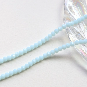 Macro detail of 4mm light blue faceted crystal rondelle beads for jewelry making