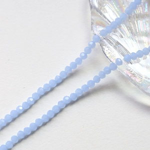 Macro shot of 4mm faceted light blue crystal beads for DIY jewelry making and crafts
