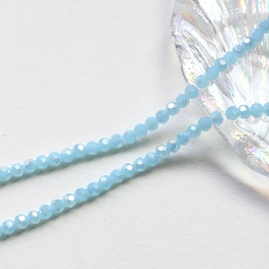 Macro detail of 4mm light blue faceted crystal wheel beads for DIY jewelry making