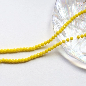 Macro view of 4mm faceted yellow crystal wheel beads for DIY jewelry making