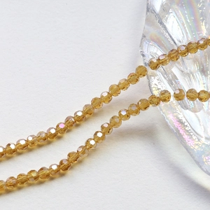 Macro view of 4mm faceted amber crystal beads for DIY jewelry and bracelet making