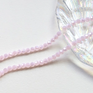 Macro shot of 4mm faceted light pink crystal beads for DIY jewelry making accessories