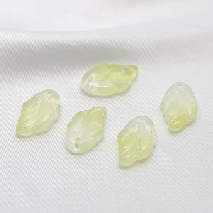Detail of 5 light green translucent glass leaf charms with vein texture for DIY jewelry